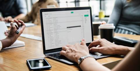 6 Time Tested Email Marketing Strategy For Your Business header image of the blog title "6 Time Tested Email Marketing Strategy For Your Business" with a background image of 5 persons in a room discussing